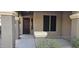 Front entry with a dark brown door and sidelights at 17913 W Desert View Ln, Goodyear, AZ 85338