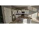 Kitchen with white cabinets, granite countertops, and stainless steel appliances at 17913 W Desert View Ln, Goodyear, AZ 85338
