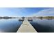 Lake dock with benches offering scenic views at 17913 W Desert View Ln, Goodyear, AZ 85338