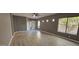 Living room with hardwood floors and neutral walls, and view to entry at 17913 W Desert View Ln, Goodyear, AZ 85338