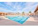 Inviting community pool with ample lounge chairs and shade structures at 1889 Leisure World --, Mesa, AZ 85206