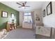 Bright Bedroom with crib, dresser, and charming decor at 1969 W Kinfield Trl, Phoenix, AZ 85085