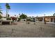 Large backyard with gravel, hot tub and patio at 20 E Tam Oshanter Dr, Phoenix, AZ 85022