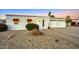 Single story home with two car garage, desert landscaping, and attractive facade at 20 E Tam Oshanter Dr, Phoenix, AZ 85022