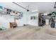 Garage with overhead storage and wall shelving at 2710 E Sunrise Pl, Chandler, AZ 85286