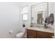 Clean bathroom with granite countertop vanity and large mirror at 31617 N 123Rd Ln, Peoria, AZ 85383