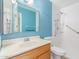 Clean bathroom with light blue walls, shower, and toilet at 4439 W Solano N Dr, Glendale, AZ 85301