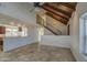 Open living room with a view into the kitchen and a tiled floor at 4521 W Milky Way, Chandler, AZ 85226