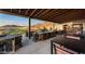 Outdoor patio with mountain views and seating at 4703 N 206Th Dr, Buckeye, AZ 85396