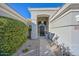 Inviting entryway with a charming walkway and lush landscaping at 6344 W Tether Trail Trl, Phoenix, AZ 85083