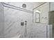 Large walk-in shower with marble tile and glass enclosure at 6344 W Tether Trail Trl, Phoenix, AZ 85083