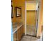 Bright bathroom with double sink vanity, and access to a large closet at 771 E Pepper Dr, Casa Grande, AZ 85122