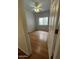 Well-lit bedroom with wood-look floors and a ceiling fan at 771 E Pepper Dr, Casa Grande, AZ 85122