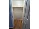 Walk-in closet with wood-look flooring and a hanging rod at 771 E Pepper Dr, Casa Grande, AZ 85122
