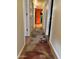 Bright hallway with wood flooring and patterned rug leading to other rooms at 771 E Pepper Dr, Casa Grande, AZ 85122
