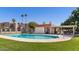 Community pool with grassy area and covered patio at 771 E Pepper Dr, Casa Grande, AZ 85122