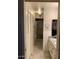 Bathroom with granite countertop, tiled shower, and linen closet at 7950 E Keats Ave # 194, Mesa, AZ 85209