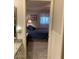 Bedroom with access to bathroom and a view of the bed at 7950 E Keats Ave # 194, Mesa, AZ 85209