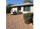 House exterior showcasing a desert landscaping and two-car garage at 7950 E Keats Ave # 194, Mesa, AZ 85209