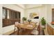 Bright dining area with wood table and natural light at 10803 E La Junta Rd, Scottsdale, AZ 85255