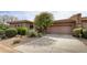 Single-story home with attached garage and desert landscaping at 10803 E La Junta Rd, Scottsdale, AZ 85255