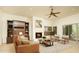 Bright living room with fireplace and built-in shelving at 10803 E La Junta Rd, Scottsdale, AZ 85255
