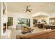 Spacious living room with fireplace and kitchen views at 10803 E La Junta Rd, Scottsdale, AZ 85255