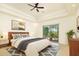 Bright main bedroom with sliding glass doors leading to a private patio at 10803 E La Junta Rd, Scottsdale, AZ 85255