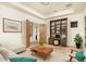 Home office with built-in shelves, desk, and comfortable seating at 10803 E La Junta Rd, Scottsdale, AZ 85255