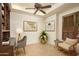 Home office with built-in shelves, desk, and comfortable seating at 10803 E La Junta Rd, Scottsdale, AZ 85255