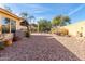 Spacious backyard with gravel landscaping and a covered patio at 1162 N 88Th St, Mesa, AZ 85207