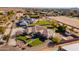 Aerial view of a house with a large yard, and solar panels at 21391 E Orchard Ln, Queen Creek, AZ 85142