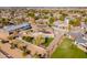 Aerial view of a house with a large backyard and surrounding neighborhood at 21391 E Orchard Ln, Queen Creek, AZ 85142