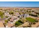 Aerial view of a house and neighborhood with mountain views at 21391 E Orchard Ln, Queen Creek, AZ 85142