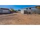 Backyard with shed, garden beds, and a dog run at 21391 E Orchard Ln, Queen Creek, AZ 85142
