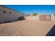 Landscaped backyard with gravel area and gate at 21391 E Orchard Ln, Queen Creek, AZ 85142