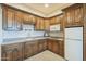 Modern kitchenette in the basement, featuring wood cabinets at 21391 E Orchard Ln, Queen Creek, AZ 85142