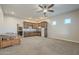 Spacious basement room with kitchenette and built-in cabinetry at 21391 E Orchard Ln, Queen Creek, AZ 85142