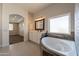 Spa-like bathroom with a corner soaking tub and walk-in shower at 21391 E Orchard Ln, Queen Creek, AZ 85142