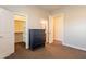 Bedroom with a dresser and an ensuite bathroom at 21391 E Orchard Ln, Queen Creek, AZ 85142