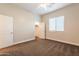 Spacious bedroom with closet and window coverings at 21391 E Orchard Ln, Queen Creek, AZ 85142
