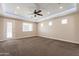 Spacious bedroom with carpet, ceiling fan, and neutral walls at 21391 E Orchard Ln, Queen Creek, AZ 85142