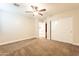 Bright bedroom with plush carpeting and double door closet at 21391 E Orchard Ln, Queen Creek, AZ 85142