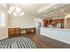 Bright dining room with wood-look floors and a stylish chandelier at 21391 E Orchard Ln, Queen Creek, AZ 85142