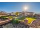 Beautiful ranch home with brick accents and a lush, manicured lawn at 21391 E Orchard Ln, Queen Creek, AZ 85142