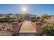 Brick walkway leads to a charming ranch home with a well-maintained lawn at 21391 E Orchard Ln, Queen Creek, AZ 85142
