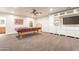 Spacious game room with pool table and entertainment center at 21391 E Orchard Ln, Queen Creek, AZ 85142