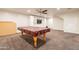 Game room with pool table and plenty of space for entertainment at 21391 E Orchard Ln, Queen Creek, AZ 85142