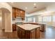 Gourmet kitchen featuring an island, custom cabinetry, and tile flooring at 21391 E Orchard Ln, Queen Creek, AZ 85142