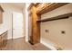 Well-appointed laundry room with ample cabinetry and built-in storage at 21391 E Orchard Ln, Queen Creek, AZ 85142